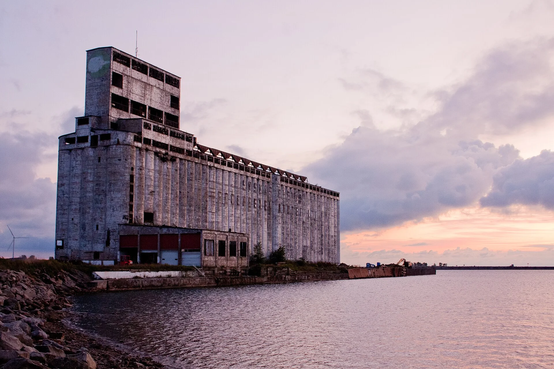 Historic grain elevator along Buffalo's waterfront at sunset